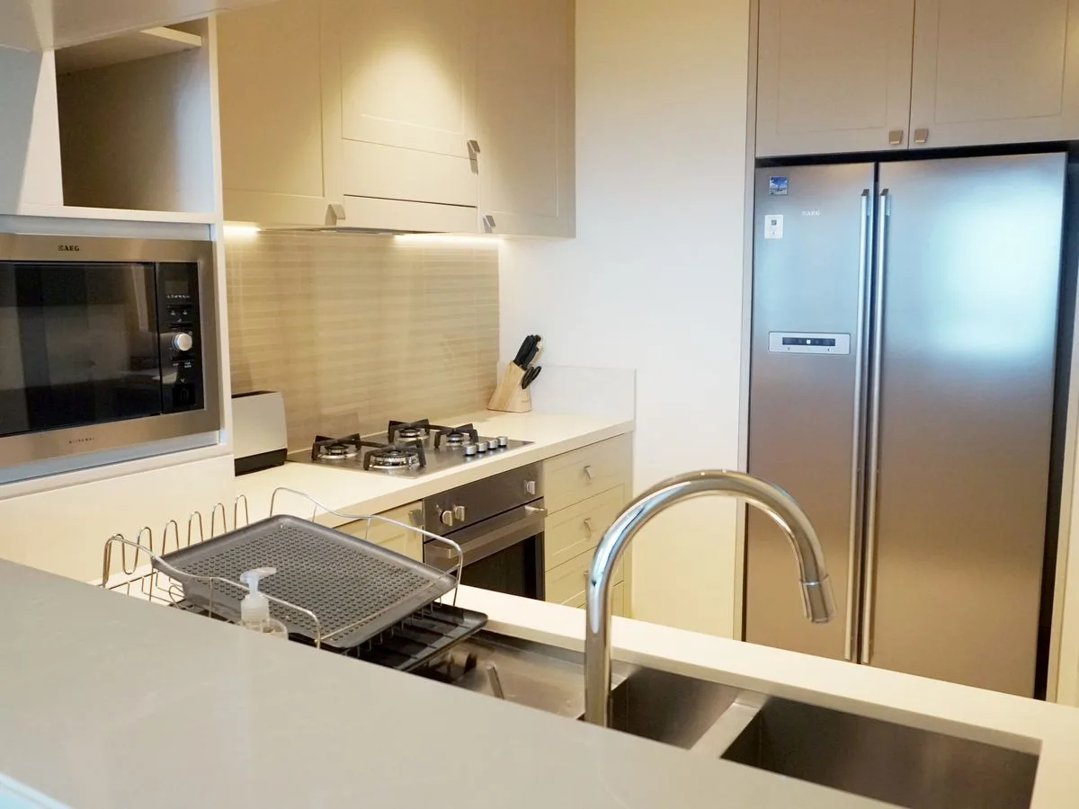 Modern kitchen with a stainless steel side-by-side refrigerator