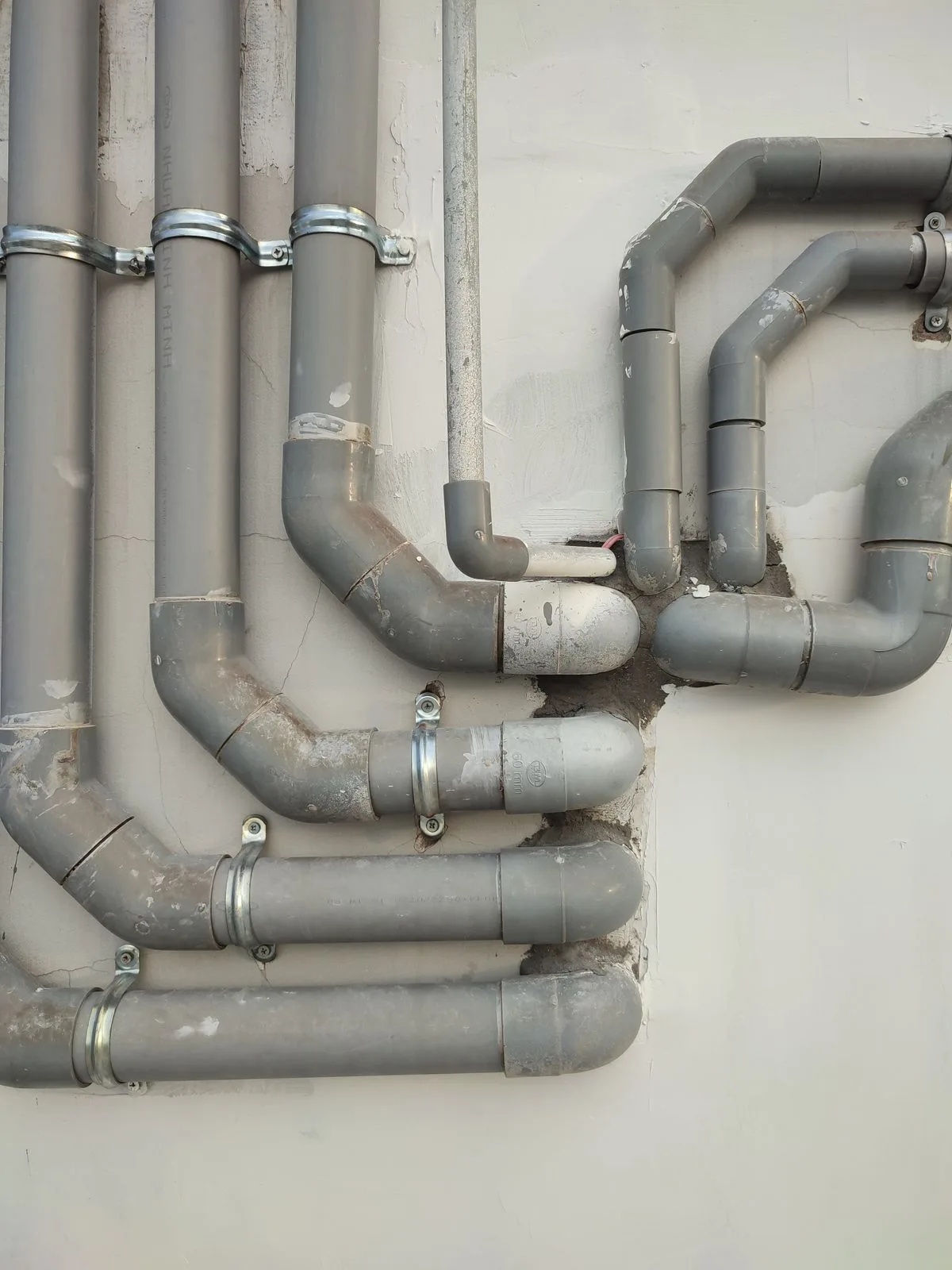 Exposed plumbing pipes in a North Texas home, vulnerable to freeze bursts