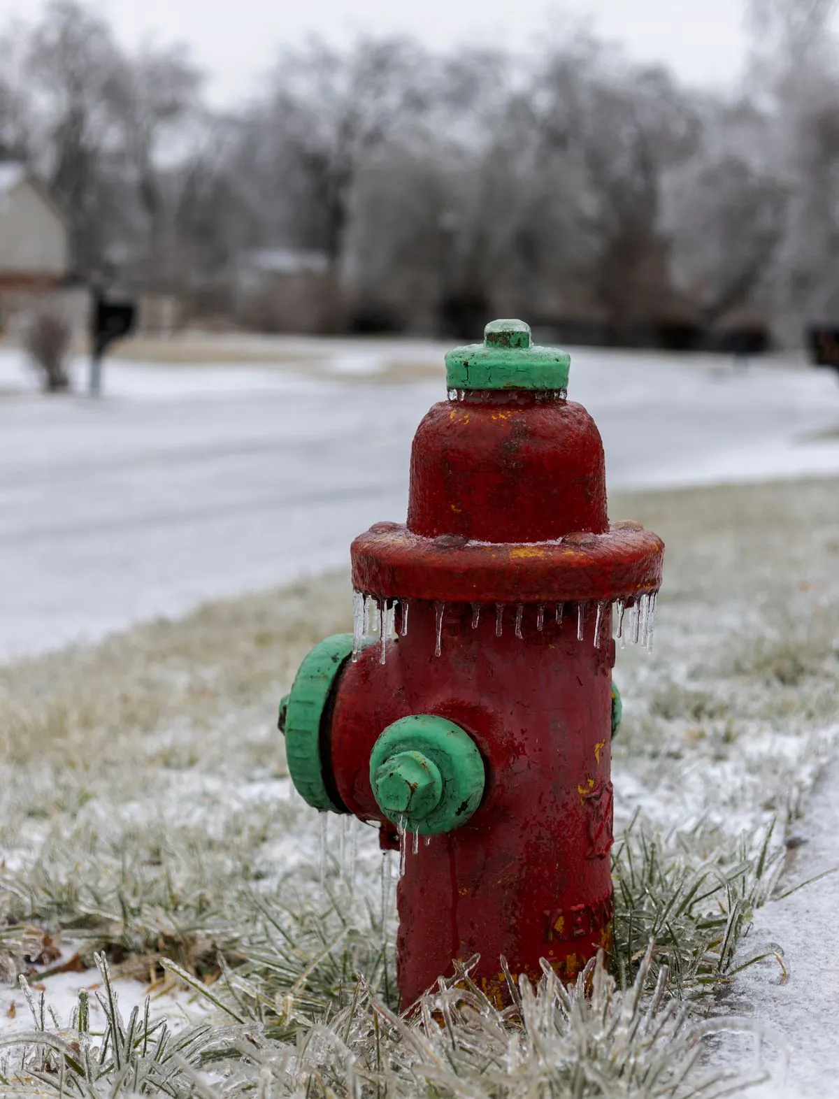 Frozen fire hydrant covered in icicles during a Texas winter freeze